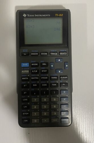 Texas Instruments TI-82 Graphing Calculator With Slide Cover. Working