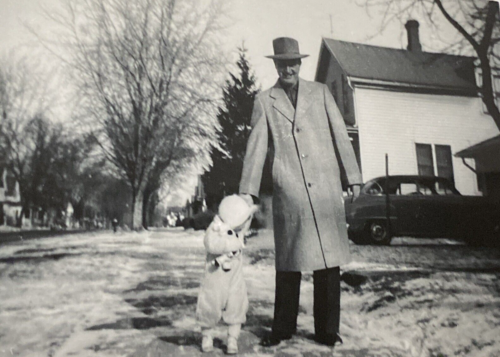 1953 Cute Little Girl Holding Toy Doll Winter Snow Sidewalk Man Old Photo P15e27