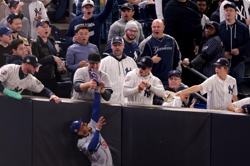 Mookie Betts ‘thought about throwing a ball at’ Yankees fans who grabbed his glove, wrist