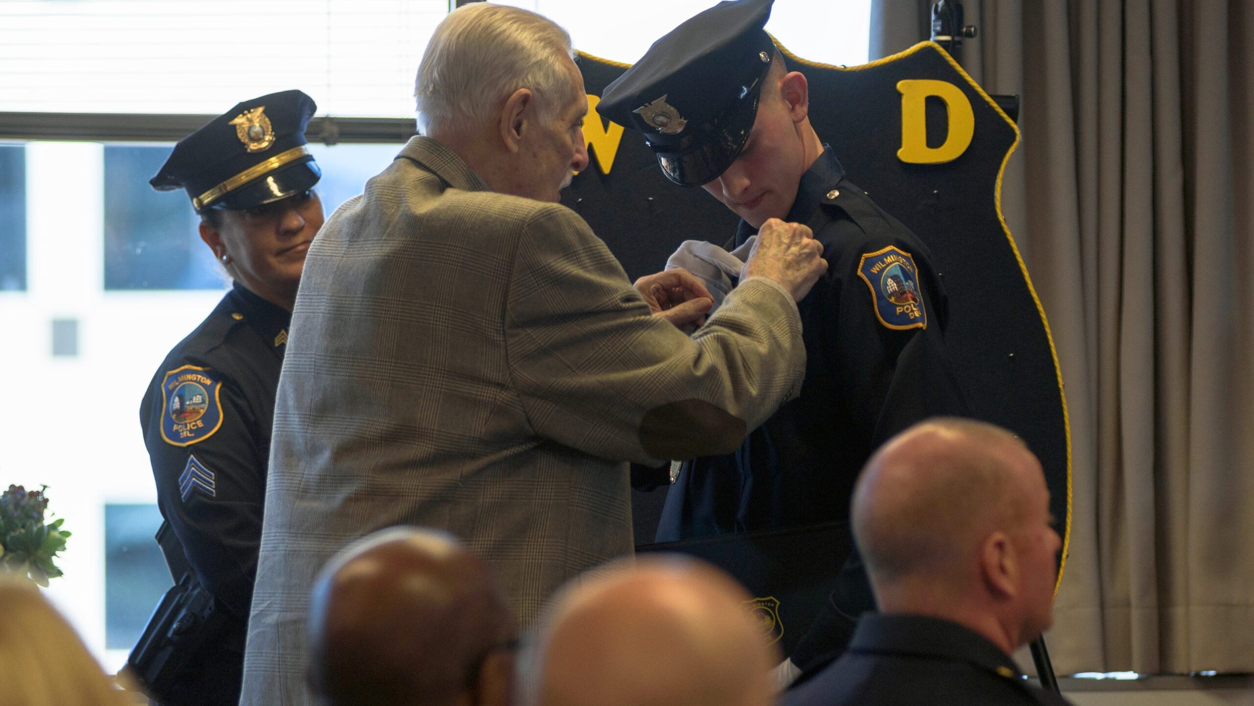 Wilmington police officer gets grandfather’s badge number at graduation