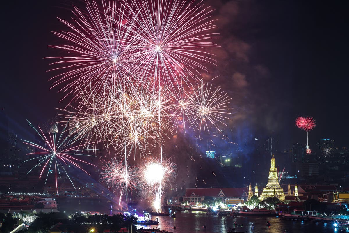 New Year’s Eve – live: Celebrations across world as countdown begins to London fireworks despite bad weather