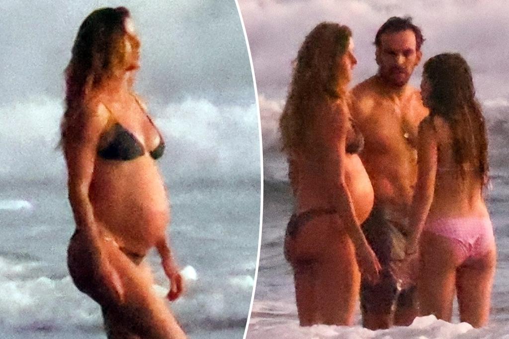 Bikini-clad Gisele Bundchen shows off baby bump on beach with boyfriend